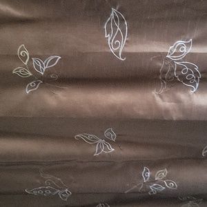 Brown shower curtain with embroidered flowers